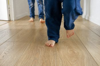 Happy children's feet playing football on wooden floor at corridor in house. Children happiness, fun, joy, game SSUCv3H4sIAAAAAAAACpyRwW7DIAyG75P2DhHnRkpGlKZ9lWoHB2iDSqAC0mmq+u4zkEQ+72Z/tn/849fnR1WxEYIW7Fy9Uoa5NmYJ0UPUziJuDiv3ykrlKXl63jcUgKaZkjo6r8FQOEIUk4VZIbSLMQm/c5GFCHEJKqRdViQgqhtqFLhLlIUvJa+2Qi7iBJYYOxAWljGzDRXxf02W4Hs3fFNW/OaFiRGvjIJi5FJa2f0nKj9Ta7BI7YirpxNgUgMnSg+vhbY3MubilI+wjQm32OjTCvvmzDj3gNGkL76iptr4BCFgu9w4eUjgyd1M3rEuZgOrKpN4iZS2nPPuqx9OHUbHYeD92lCuN2nUyetsQpiLu5bUuk4bsJE3XJy6oR6OHdRdKzBqelmP/akF2Vx5e2zx499/AAAA//8DAOcWEM+mAgAA